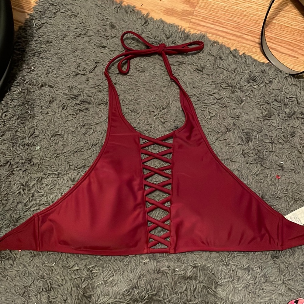 Crossed into the front, fun, cute bathing suit top.